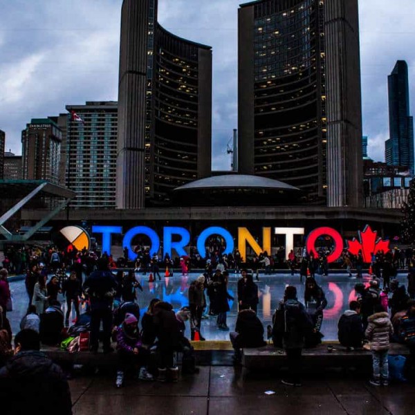 people-gathered-in-front-of-toronto-freestanding-signage-1750754
